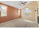 Neutral bedroom featuring carpet and multiple windows with blinds at 1065 Cobblestone Dr, Highlands Ranch, CO 80126