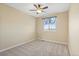 Neutral bedroom with carpet, window, and fan at 1065 Cobblestone Dr, Highlands Ranch, CO 80126