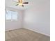 Bedroom featuring a window for natural light and neutral carpet at 1065 Cobblestone Dr, Highlands Ranch, CO 80126