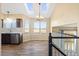 Bright dining area with skylights, wood flooring, and modern lighting fixture at 1065 Cobblestone Dr, Highlands Ranch, CO 80126