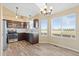 Eat in kitchen featuring stainless steel appliances, ample counter space, and natural light at 1065 Cobblestone Dr, Highlands Ranch, CO 80126