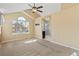 Spacious main bedroom featuring carpet and an ensuite bathroom with shower at 1065 Cobblestone Dr, Highlands Ranch, CO 80126