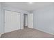 Carpeted bedroom with a closet and connecting rooms at 12711 Colorado Blvd # 1116, Thornton, CO 80241