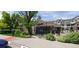 Community clubhouse with well-kept landscaping, seating and path at 12711 Colorado Blvd # 1116, Thornton, CO 80241