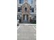 Attractive condo entrance featuring stone archway and well-maintained landscaping at 12711 Colorado Blvd # 1116, Thornton, CO 80241