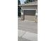Garage door with neutral color and paneled design, complemented by stone accents at 12711 Colorado Blvd # 1116, Thornton, CO 80241