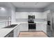 Contemporary kitchen showcases stainless steel appliances, white cabinetry, and sleek countertops at 12711 Colorado Blvd # 1116, Thornton, CO 80241
