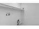 Simple white laundry room with shelf and hookups at 12711 Colorado Blvd # 1116, Thornton, CO 80241
