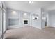 Inviting living room features a cozy fireplace, modern lighting, and convenient kitchen access at 12711 Colorado Blvd # 1116, Thornton, CO 80241