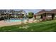 Community pool area with lots of seating and green grass at 12711 Colorado Blvd # 1116, Thornton, CO 80241
