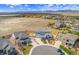 Expansive aerial view of the neighborhood showcasing a large open field and mountain views at 4220 Kestrel Dr, Broomfield, CO 80023