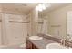 Clean secondary bathroom with shower-tub combo, and dual sinks at 4220 Kestrel Dr, Broomfield, CO 80023