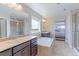 Bright bathroom features dual sinks, soaking tub, and a large window with a view at 4220 Kestrel Dr, Broomfield, CO 80023