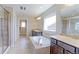 Spacious bathroom features a soaking tub, dual sinks, and tiled shower at 4220 Kestrel Dr, Broomfield, CO 80023