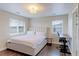 Bright bedroom features a desk area and large windows at 4220 Kestrel Dr, Broomfield, CO 80023