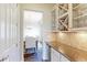 Butler's pantry featuring granite countertop and wine glass storage at 4220 Kestrel Dr, Broomfield, CO 80023