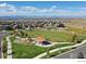 Aerial view of a neighborhood park with a playground, a pavilion and mountain views at 4220 Kestrel Dr, Broomfield, CO 80023