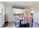 Bright dining room with large windows offering scenic views at 4220 Kestrel Dr, Broomfield, CO 80023