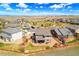 Aerial view of a home with a fenced backyard, patio, and nice landscaping at 4220 Kestrel Dr, Broomfield, CO 80023