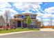 Charming two-story home boasts stone accents, lush landscaping, and a cozy covered entry at 4220 Kestrel Dr, Broomfield, CO 80023