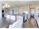 Open-concept kitchen with granite countertops, stainless steel appliances, and hardwood floors at 4220 Kestrel Dr, Broomfield, CO 80023
