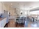 Bright kitchen with island seating, stainless steel appliances, and adjacent dining area at 4220 Kestrel Dr, Broomfield, CO 80023