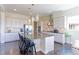 Modern kitchen featuring a large island, stainless steel appliances, and pendant lighting at 4220 Kestrel Dr, Broomfield, CO 80023