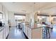 Spacious kitchen with a center island, stainless steel appliances, and an adjoining dining room at 4220 Kestrel Dr, Broomfield, CO 80023