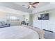 Bright main bedroom with dark floors, work space, and large window with stunning views at 4220 Kestrel Dr, Broomfield, CO 80023