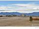Scenic view of the majestic Rocky Mountains from a community with sprawling grasslands at 4220 Kestrel Dr, Broomfield, CO 80023