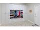 Organized mudroom with custom cabinets, shoe racks, and coat hooks for storage at 4220 Kestrel Dr, Broomfield, CO 80023
