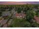 This home features mature landscaping, solar panels, a deck, and a large yard at 8525 Grandview Ave, Arvada, CO 80002