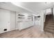 Basement featuring hardwood floors, a sink and cabinets, and a washer and dryer at 8525 Grandview Ave, Arvada, CO 80002
