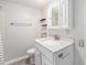 Updated bathroom with vanity, sink, and brushed nickel faucet at 8525 Grandview Ave, Arvada, CO 80002