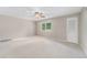 Bright bedroom featuring a ceiling fan, natural light from a window, and closet door at 8525 Grandview Ave, Arvada, CO 80002