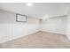 Cozy bedroom featuring plush carpet, white wainscoting, and abundant natural light at 8525 Grandview Ave, Arvada, CO 80002