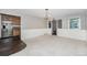 Open dining area with large windows, wainscotting, chandelier, and carpet at 8525 Grandview Ave, Arvada, CO 80002