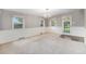 Open dining area with chandelier, wainscotting and door to back yard at 8525 Grandview Ave, Arvada, CO 80002