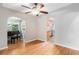 Bright dining area showcasing hardwood floors and connecting seamlessly to the kitchen and living spaces at 8525 Grandview Ave, Arvada, CO 80002