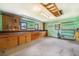 Spacious garage with built-in cabinets, pegboard, shelving and lots of work space at 8525 Grandview Ave, Arvada, CO 80002