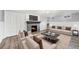 Basement living room featuring a fireplace, television and neutral decor at 8525 Grandview Ave, Arvada, CO 80002