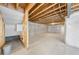 Unfinished basement with high ceilings and ample storage space at 7210 Watercress Dr, Littleton, CO 80125