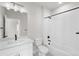 Clean bathroom with white vanity, bathtub, and shower at 7210 Watercress Dr, Littleton, CO 80125