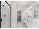 Double vanity bathroom with a walk-in shower at 7210 Watercress Dr, Littleton, CO 80125