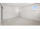 Spacious bedroom with carpeted floor and barn door at 7210 Watercress Dr, Littleton, CO 80125