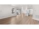 Open concept living area with hardwood floors and kitchen view at 7210 Watercress Dr, Littleton, CO 80125