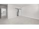Main bedroom with barn door entry to en-suite bathroom at 7210 Watercress Dr, Littleton, CO 80125