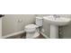 Modern half-bathroom featuring a pedestal sink and fixtures at 468 Millwall Cir, Castle Pines, CO 80108