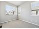 Well-lit bedroom with two large windows and neutral carpeting at 468 Millwall Cir, Castle Pines, CO 80108