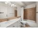 This bathroom is equipped with vanity and tiled shower and bath at 720 S Clinton St # 1B, Denver, CO 80247